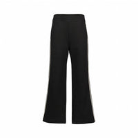 Black wide leg pants with white side stripes and elastic waistband on white background