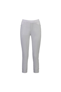 Vassalli Paris Tour Capri in Silver features a slim fit, mid-rise waistband, stretch fabric, front pockets, and cuffed hems. Displayed on a plain white background.