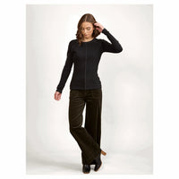 Woman wearing black long sleeve top and wide leg brown corduroy pants, fashion studio shot