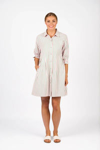 Woman wearing a striped button-front shirt dress with 3/4 sleeves, standing on white background