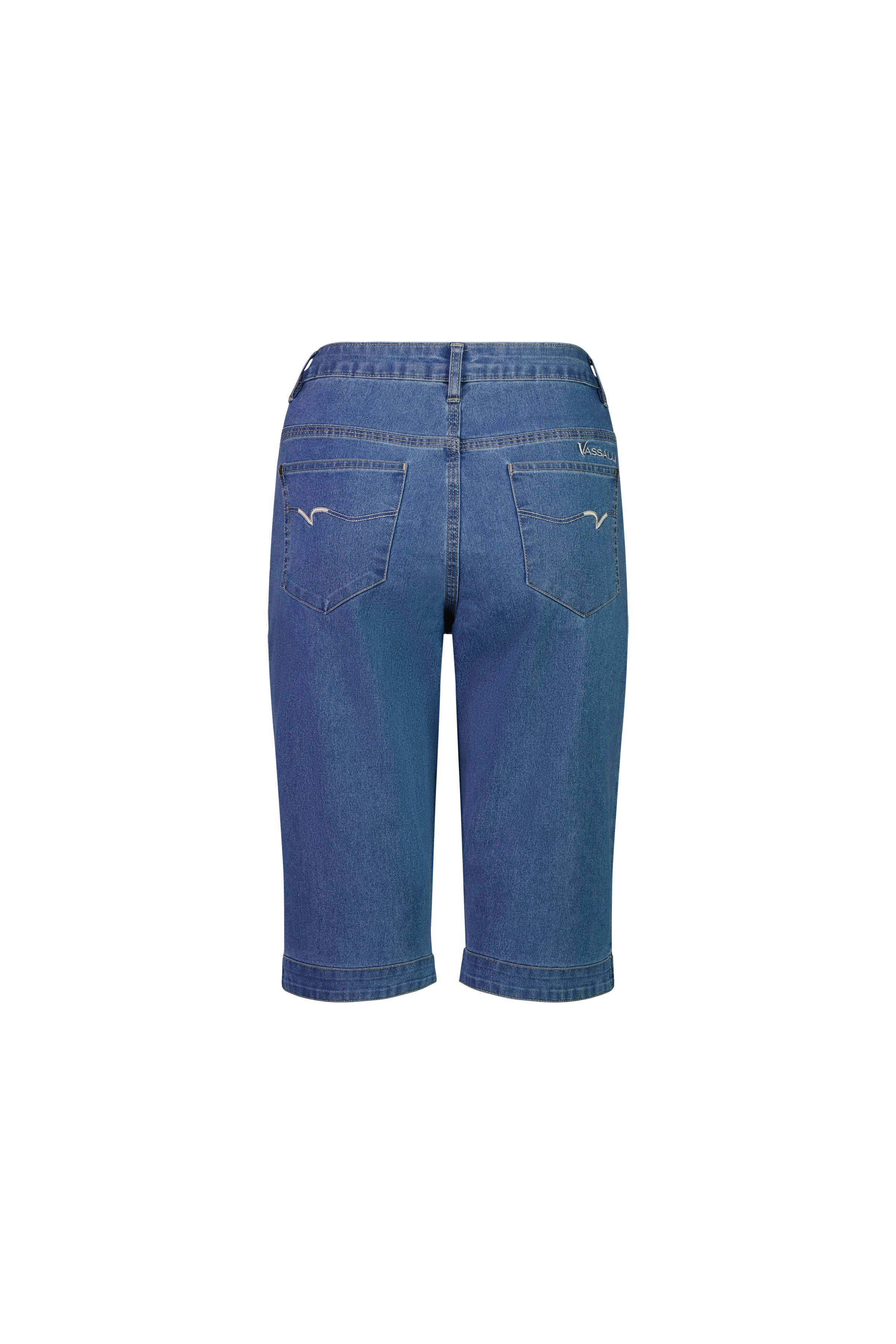 Back view of Vassalli Custom Short - Light Denim, showing stretch denim in a straight-leg cut with two back pockets, visible stitching, and a small embroidered logo on the right pocket against a white background.